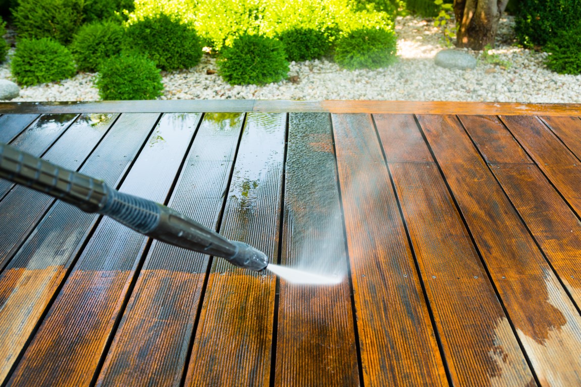 cleaning terrace with a power washer - high water pressure clean